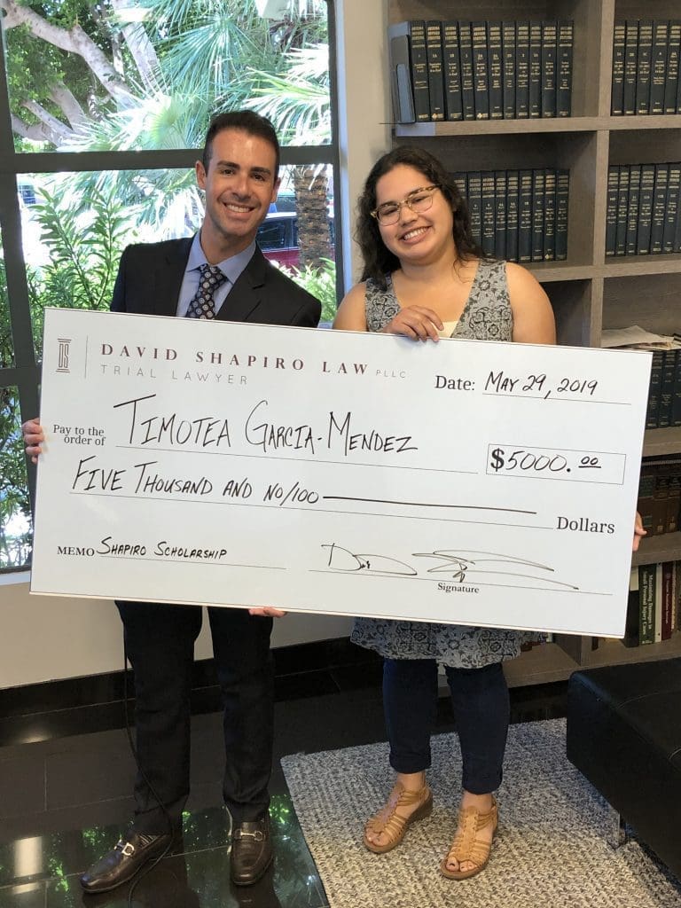 David Shapiro provides Scholarship Check to Timotea Garcia-Mendez